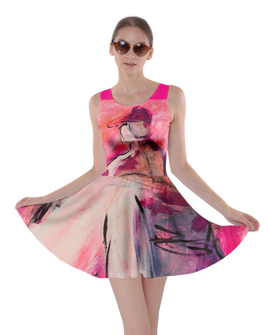  A  pink dress with a vibrant, original art print by Leeorah, designed to flatter all sizes. The dress features a relaxed silhouette and soft fabric, promising comfort and style for any occasion.Front view